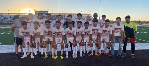 The boys soccer team celebrates their come from behind win against Garden City.