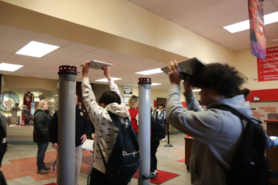 Students walk through the new weapons detection scanners last week.