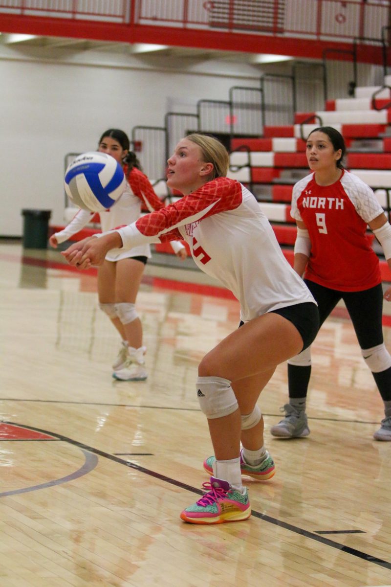 Senior Tori Buss receives a serve in a match earlier this season. The team is 18-4 on season and ranked 6th in Class 6A.