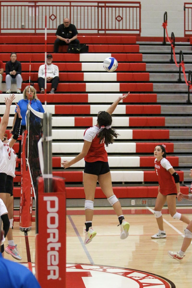 Senior Andrea Hernandez goes for the kill against Maize in the sub-state championship.