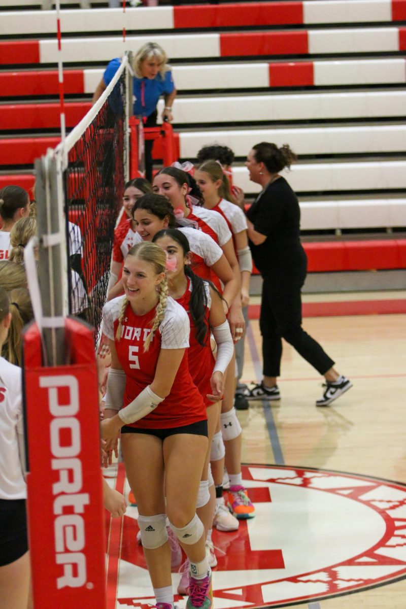 North and Maize shake hands at the end of their match. North won 25-16, 25-22.