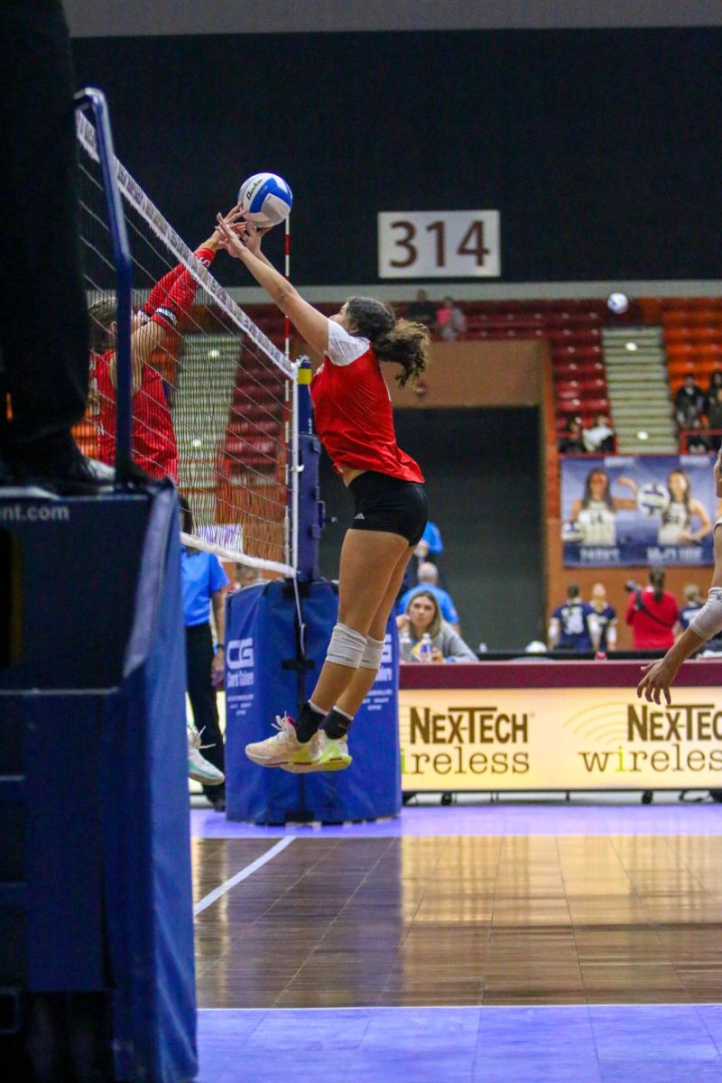 Senior Andrea Hernandez attempts to block a Blue Valley West kill at the Class 6A tournament.