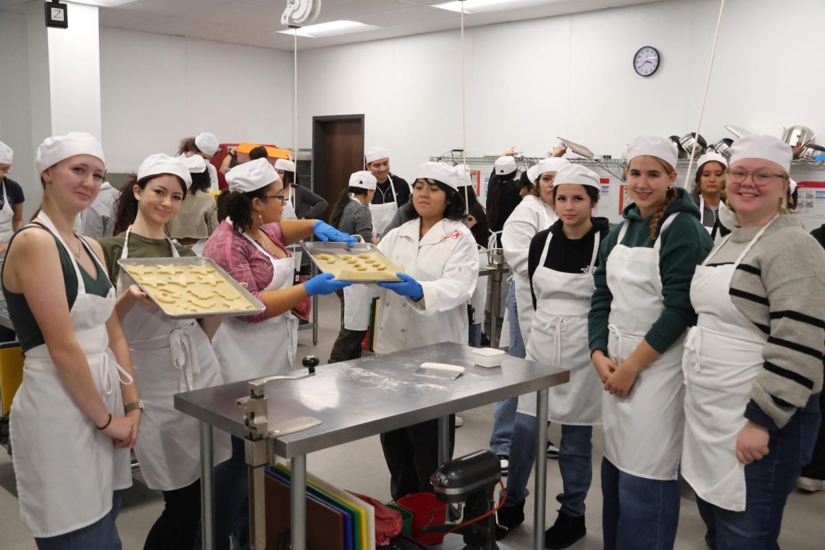 Students from Baking and Pastry and German classes work together to create cookies to celebrate St. Martin's Day.