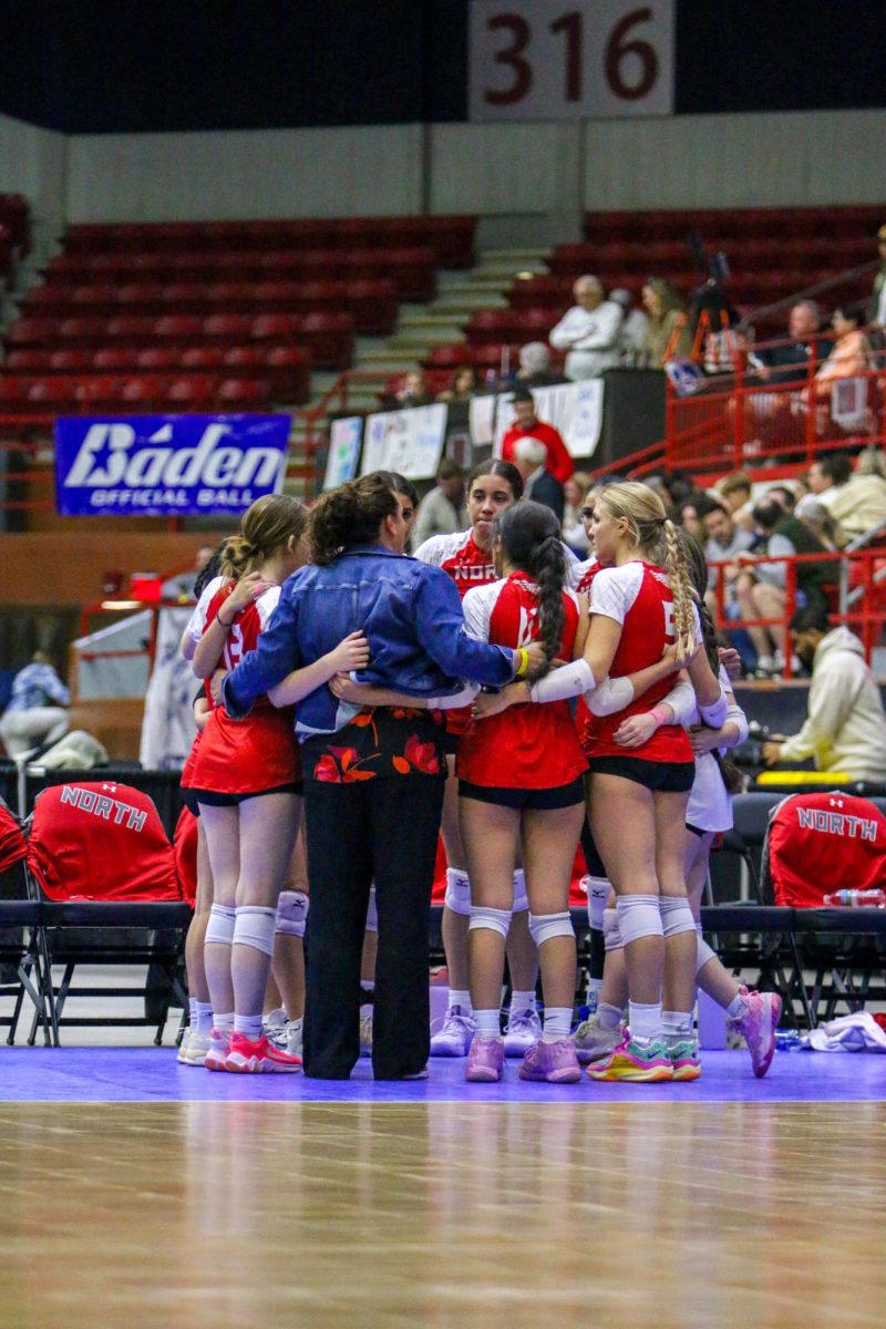 Coach Jessica Keys brings the team together during a time out. North was playing in the Class 6A tournament for the first time in 20 years.