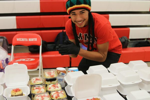 Senior Isaias Ortiz sells his pastries at Market Day.