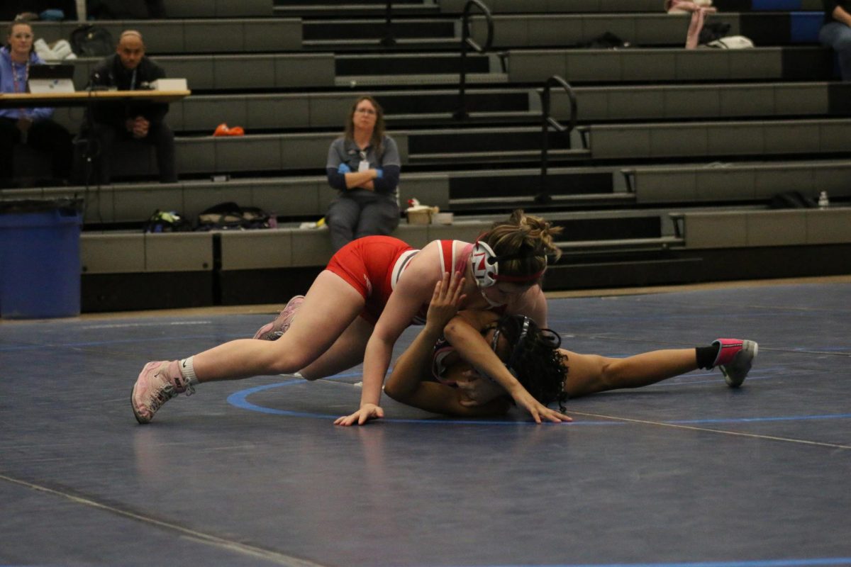 Freshman Reese Anderson goes for a pin against West High. Anderson has only lost one time so far this season.