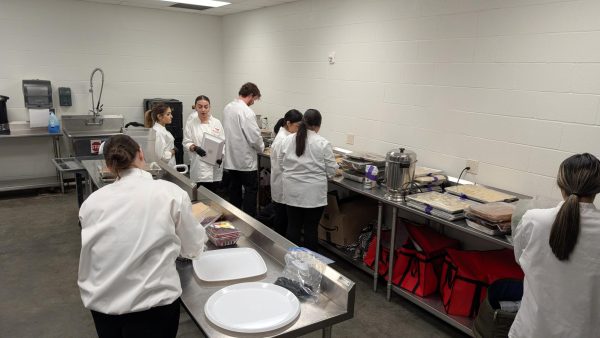 North High culinary students and baking and pastry students prepare to transport food they made for the WPS Foundation breakfast. More than 400 people were in attendance.